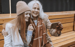 Grandma and granddaughter taking a photo.